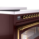 Induction range control panel with digital display and brass knob row