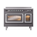 Matte graphite induction range with chrome-trim doors; right oven door open, interior visible.