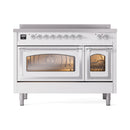 White induction range with both oven doors closed, chrome trim, and lit oven interior