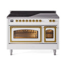 White induction range with brass-framed glass oven doors and stovetop controls