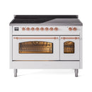 White induction range with copper-trimmed doors open, showing oven racks and interior