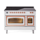 White induction range with copper-trimmed doors open, with oven cavity and racks visible